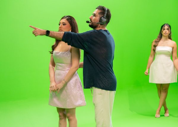 Hamed Tayebi, a professional Film Director in Dubai operating a cinema camera