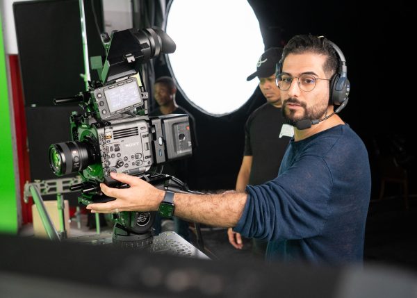 Hamed Tayebi, a professional Film Director in Dubai operating a cinema camera