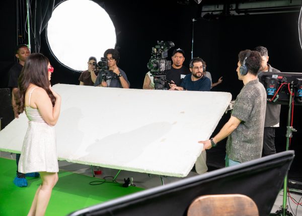 Hamed Tayebi, a professional Film Director in Dubai operating a cinema camera