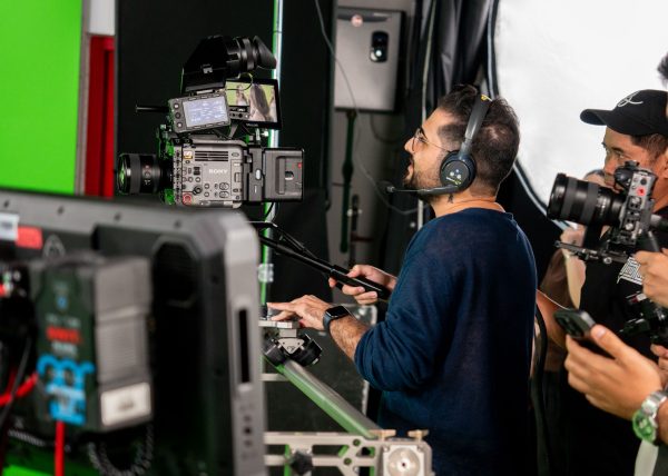 Hamed Tayebi, a professional Film Director in Dubai operating a cinema camera