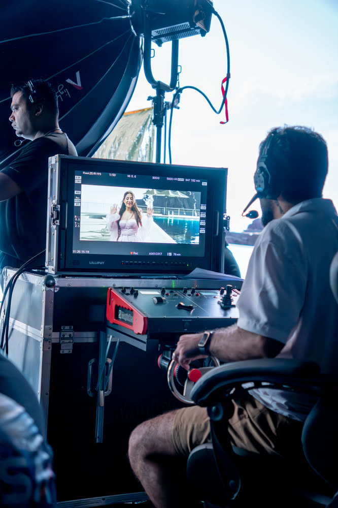 Operator watching the cinema camera feed on a monitor beside the LED volume